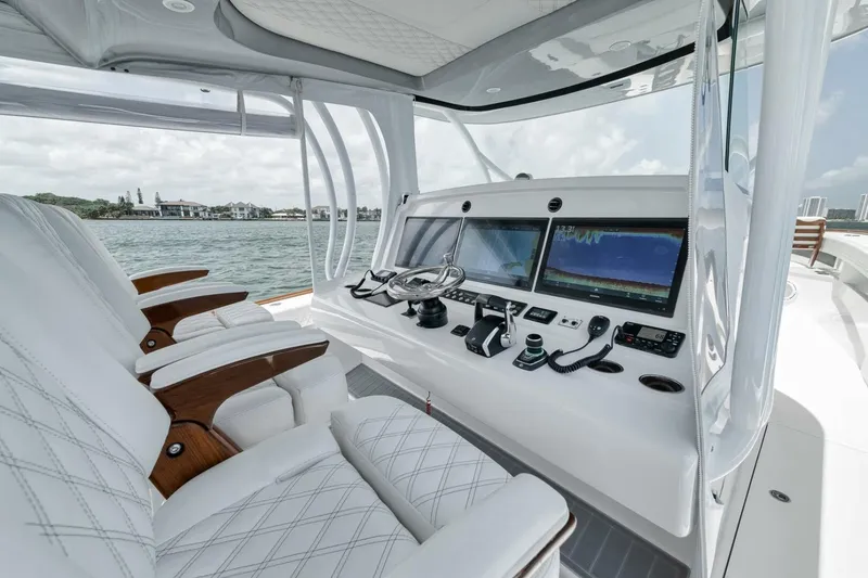 Slide: The Image of 2024 Front Runner 47 Center Console boat interior with advanced navigation displays and luxurious seating. - 28