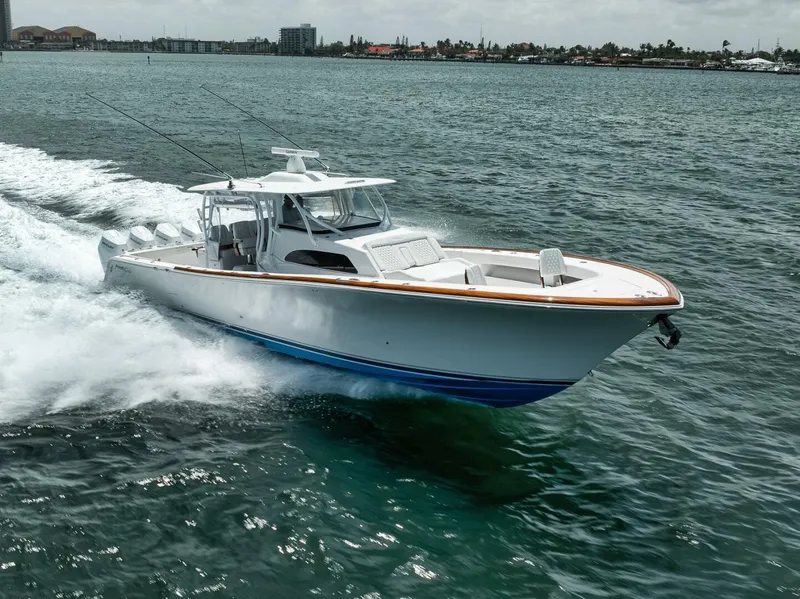 Slide: The Image of 2024 Front Runner 47 Center Console boat cruising on open water. - 3