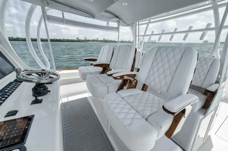 Slide: The Image of 2024 Front Runner 47 Center Console with luxurious white seating and sleek design. - 30