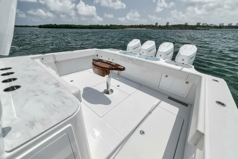 Slide: The Image of 2024 Front Runner 47 Center Console boat with quad engines on open water. - 33