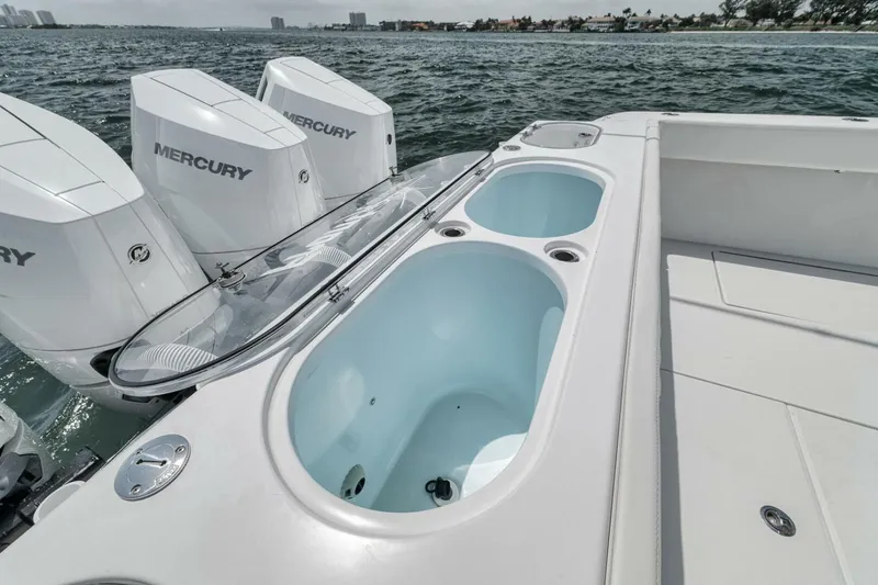 Slide: The Image of 2024 Front Runner 47 Center Console boat with Mercury engines and spacious deck features. - 36