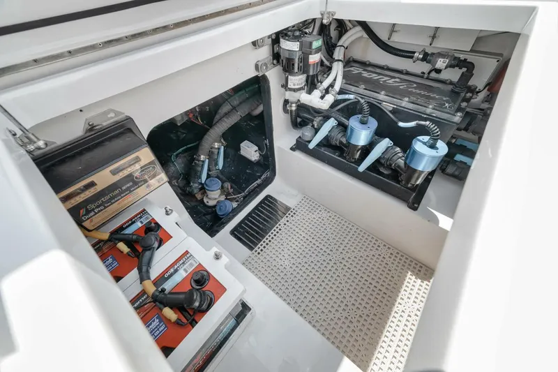 Slide: The Image of 2024 Front Runner 47 Center Console engine compartment with batteries and mechanical components. - 37