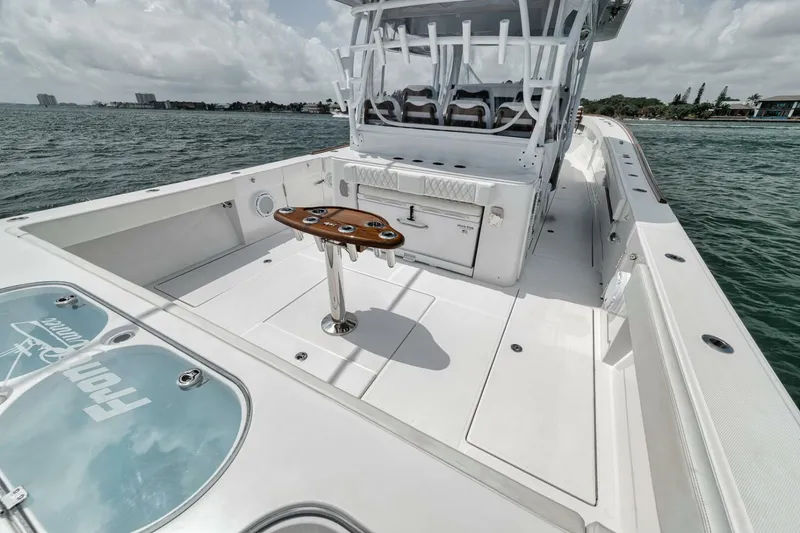 Slide: The Image of 2024 Front Runner 47 Center Console boat on water, featuring spacious deck and seating. - 40