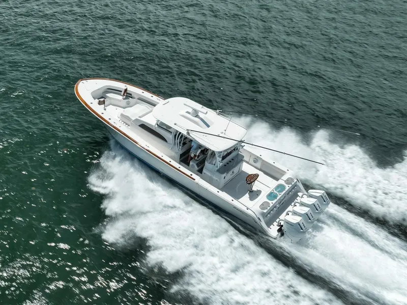 Slide: The Image of 2024 Front Runner 47 Center Console boat cruising on open water. - 6