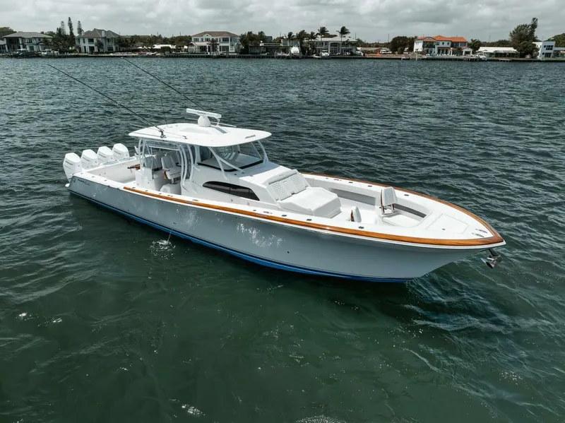 Slide: The Image of 2024 Front Runner 47 Center Console boat on water, sleek design, coastal background. - 8