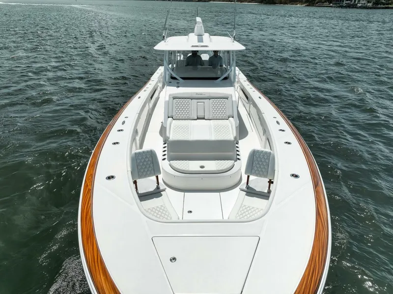 Slide: The Image of 2024 Front Runner 47 Center Console boat on water, featuring sleek design and spacious deck. - 9