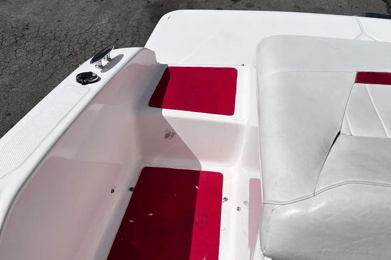 Slide: The Image of 2006 Regal 1900 Bowrider interior with red and white seating. - 10