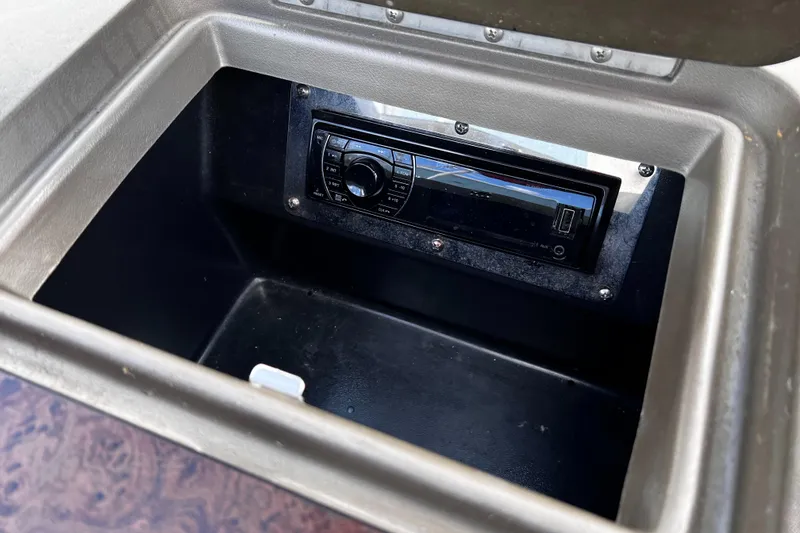 Slide: The Image of 2006 Regal 1900 Bowrider stereo system in a storage compartment. - 12