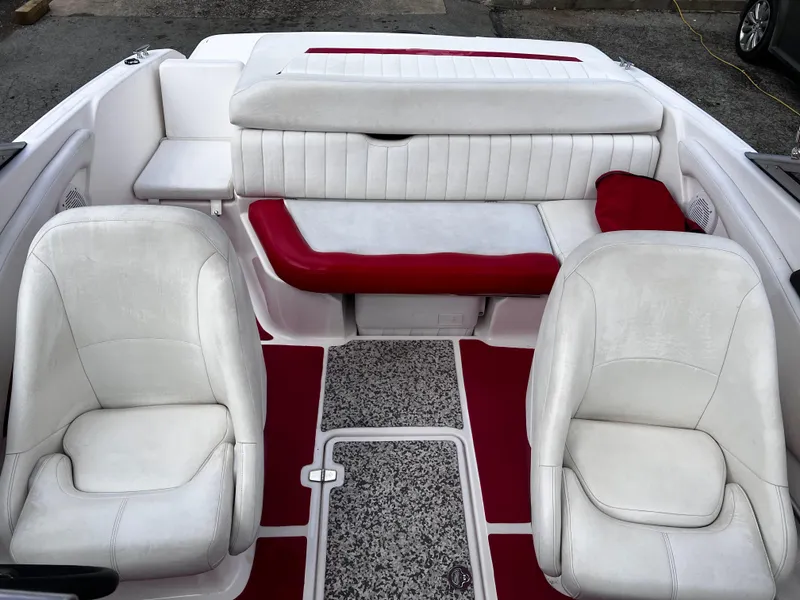 Slide: The Image of 2006 Regal 1900 Bowrider interior with white and red seating, featuring two front seats. - 6