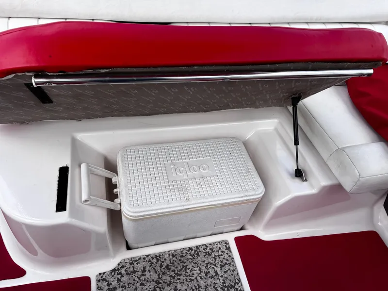 Slide: The Image of 2006 Regal 1900 Bowrider interior with red seating and Igloo cooler storage. - 7