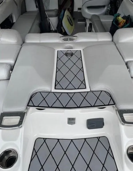 Slide: The Image of 2015 MasterCraft X23 boat interior with diamond-patterned upholstery and seating. - 11