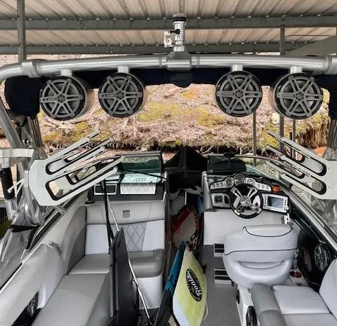 Slide: The Image of 2015 MasterCraft X23 boat interior with speakers and wakeboard racks. - 12