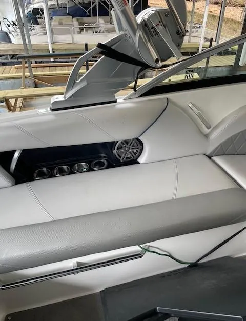 Slide: The Image of 2015 MasterCraft X23 boat interior with sleek seating and modern design. - 14