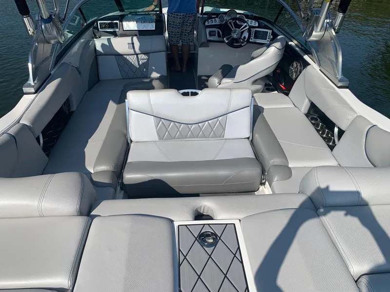 Slide: The Image of 2015 MasterCraft X23 boat interior with luxurious seating and modern dashboard. - 15