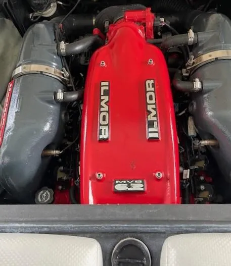 Slide: The Image of 2015 MasterCraft X23 Ilmor engine with red cover and dual intakes. - 24
