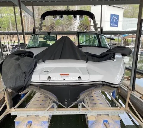 Slide: The Image of 2015 MasterCraft X23 boat covered in a marina dock. - 8