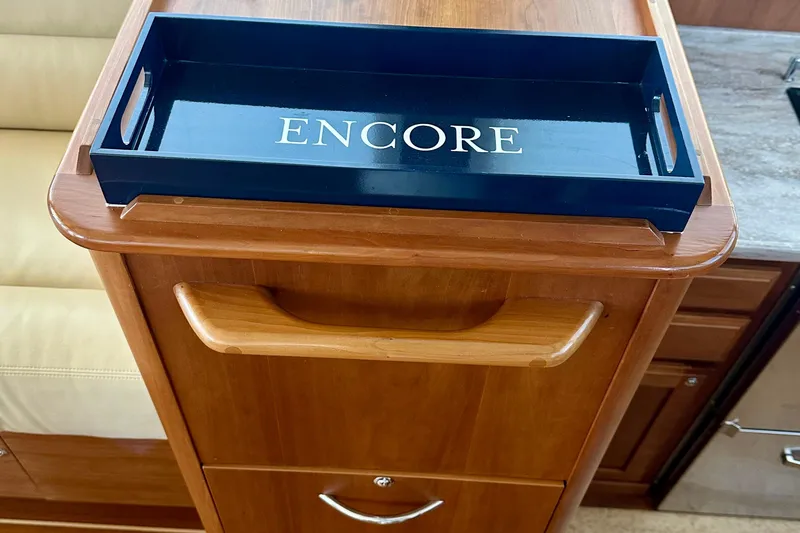 Slide: The Image of Wooden cabinet with "Encore" tray on Sabre 42 Salon Express, 2017 model. - 10