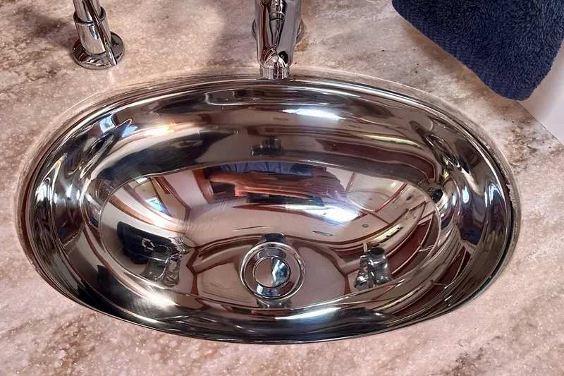 Slide: The Image of Stainless steel sink on Sabre 42 Salon Express 2017 yacht, reflecting interior details. - 15