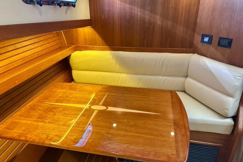 Slide: The Image of Luxurious interior of 2017 Sabre 42 Salon Express with wooden table and cream seating. - 16