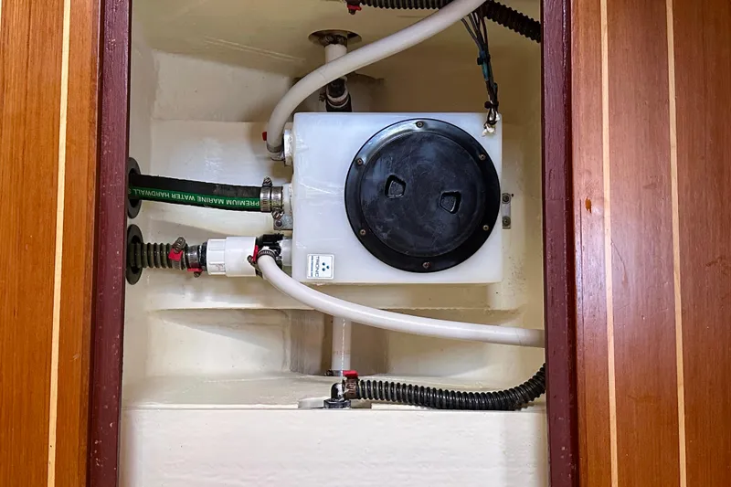 Slide: The Image of Bilge compartment of 2017 Sabre 42 Salon Express with plumbing and wiring. - 22