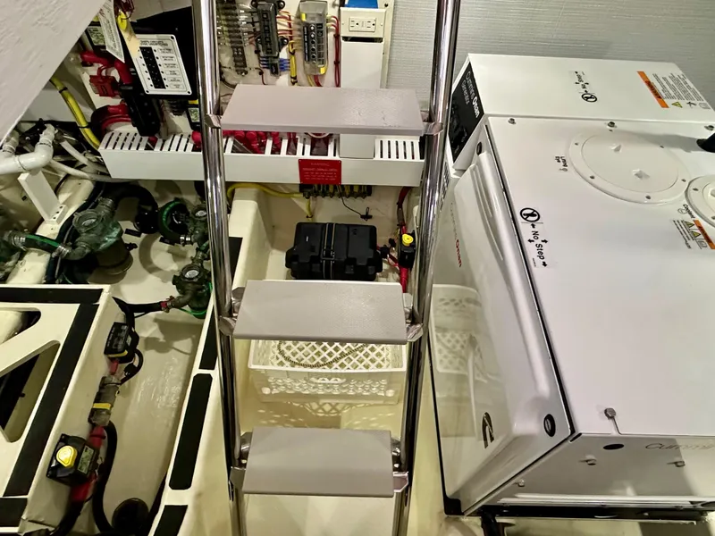 Slide: The Image of Engine room of 2017 Sabre 42 Salon Express with equipment and ladder. - 23