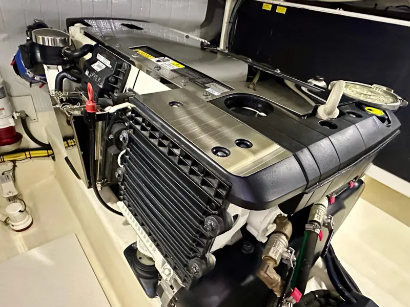 Slide: The Image of Engine compartment of a 2017 Sabre 42 Salon Express yacht, showcasing detailed machinery. - 25