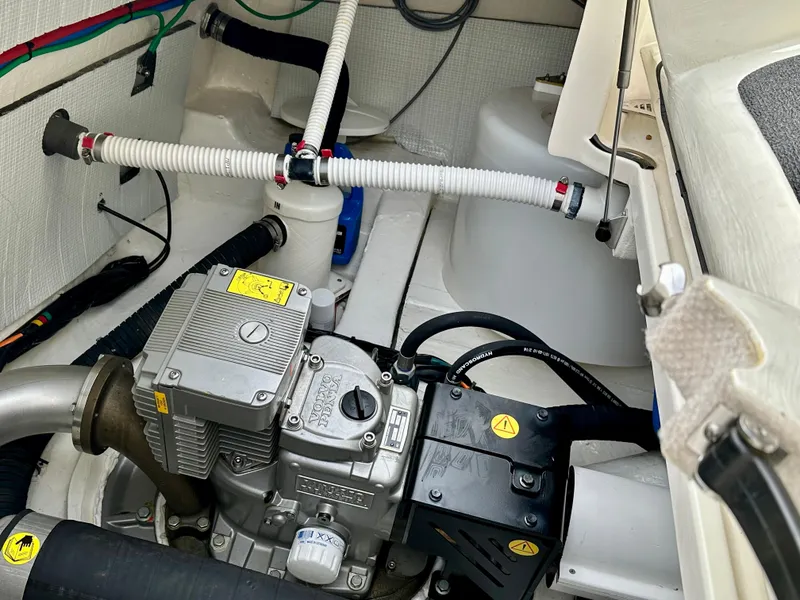 Slide: The Image of Engine compartment of a 2017 Sabre 42 Salon Express boat, showcasing mechanical components. - 27