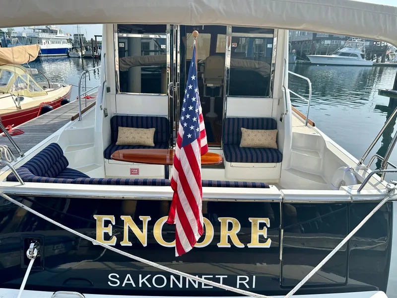 Slide: The Image of 2017 Sabre 42 Salon Express yacht "Encore" docked in Sakonnet, RI, with American flag. - 3