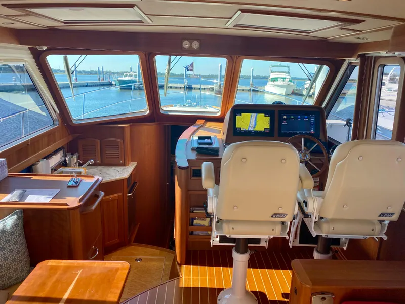 Slide: The Image of Interior of 2017 Sabre 42 Salon Express yacht with helm and seating area. - 5