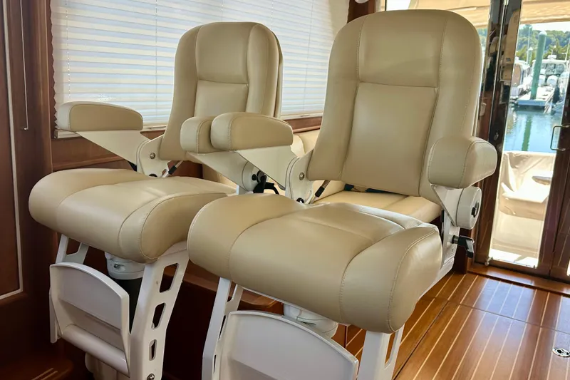 Slide: The Image of Luxurious beige captain chairs in 2017 Sabre 42 Salon Express yacht interior. - 7