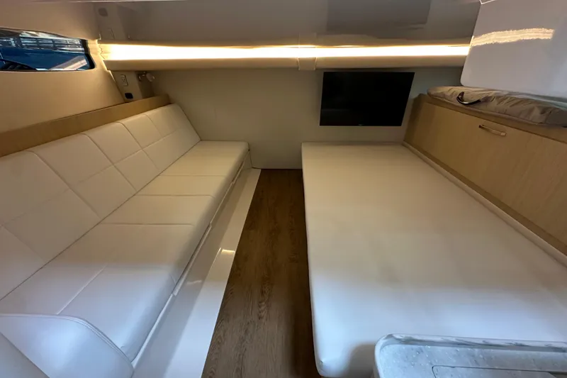 Slide: The Image of Luxurious interior of 2026 Regal 38 SAV yacht with white seating and wood accents. - 20