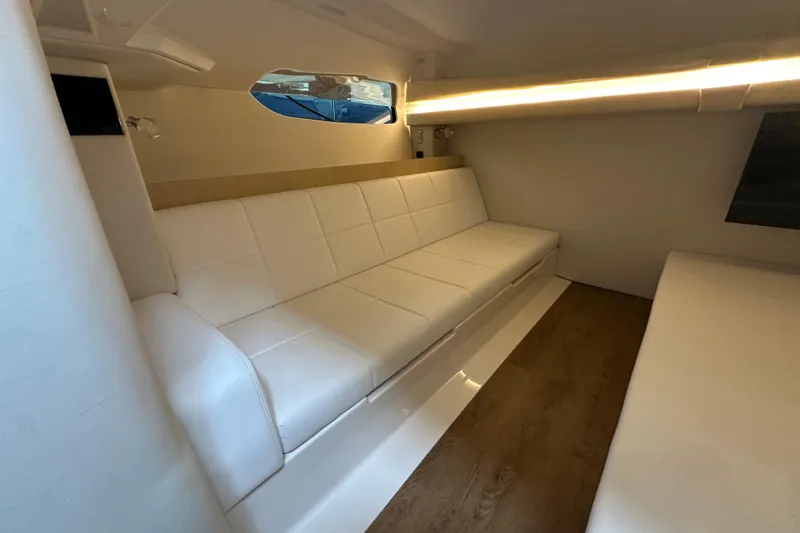 Slide: The Image of Luxurious interior of 2026 Regal 38 SAV yacht with white seating and wood flooring. - 21