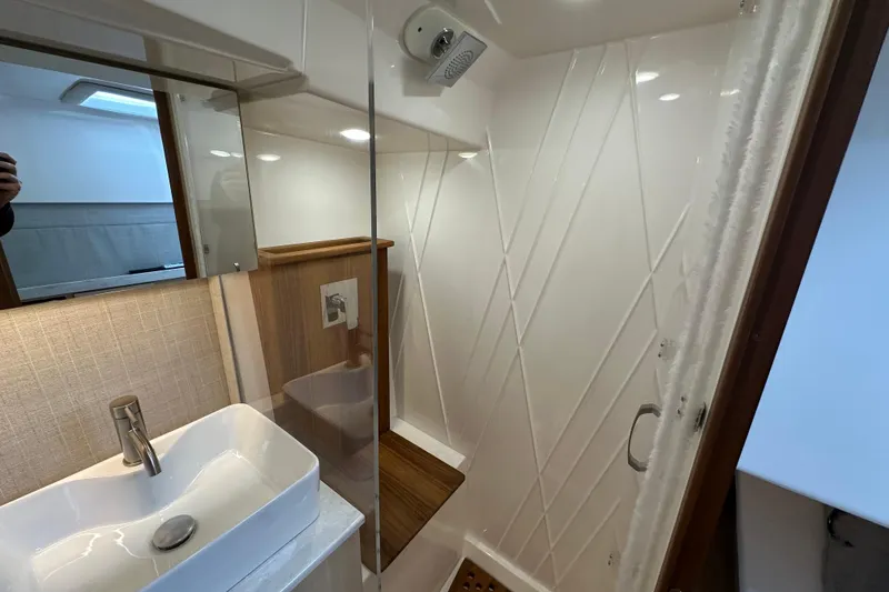Slide: The Image of Luxurious bathroom in 2026 Regal 38 SAV yacht with modern sink and shower. - 25