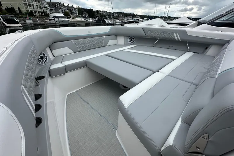 Slide: The Image of Luxurious seating area on 2026 Regal 38 SAV boat, featuring elegant gray upholstery. - 28