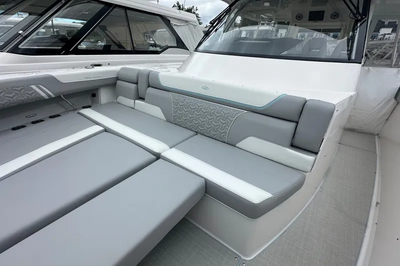 Slide: The Image of 2026 Regal 38 SAV boat interior with luxurious gray and white seating. - 29