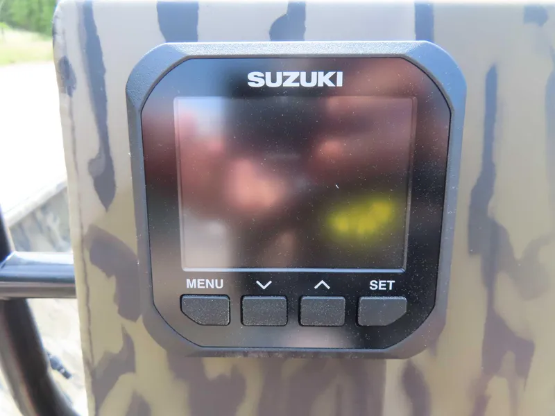 Slide: The Image of Suzuki control panel on 2024 SeaArk Shadow 19v CC boat. - 6