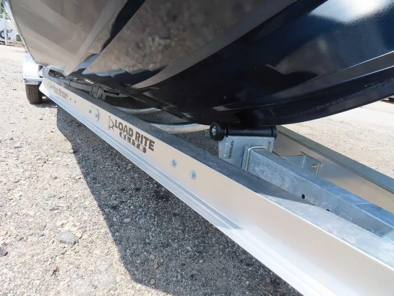 Slide: The Image of 2024 SeaArk Pro Guide 2672 on Load Rite Elite trailer, close-up view. - 24