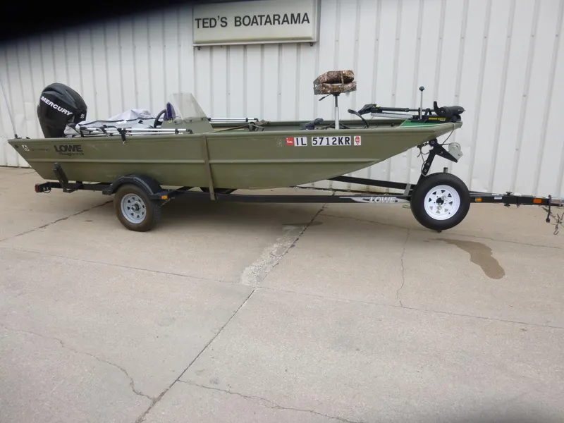 Slide: The Image of 2011 Lowe Roughneck R1760SC boat on trailer outside Ted's Boatarama. - 1
