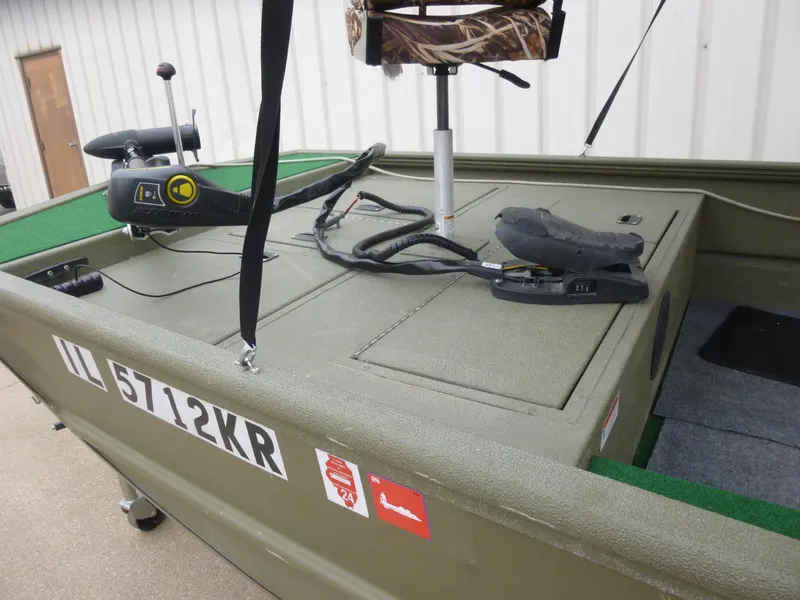Slide: The Image of 2011 Lowe Roughneck R1760SC boat with trolling motor and storage compartments. - 10
