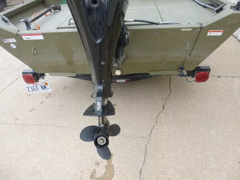 Slide: The Image of Rear view of a 2011 Lowe Roughneck R1760SC boat with motor and propeller. - 12