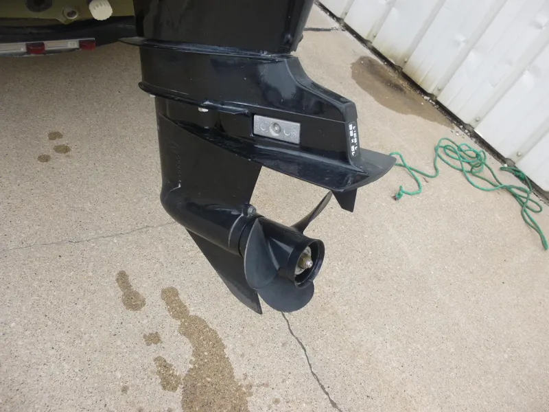 Slide: The Image of 2011 Lowe Roughneck R1760SC boat motor propeller on concrete surface. - 13