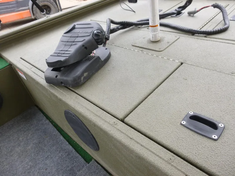 Slide: The Image of 2011 Lowe Roughneck R1760SC boat deck with trolling motor pedal. - 17