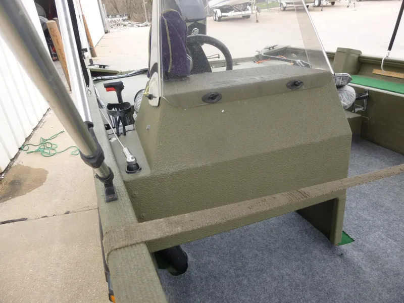 Slide: The Image of 2011 Lowe Roughneck R1760SC boat interior with steering console and seating. - 18