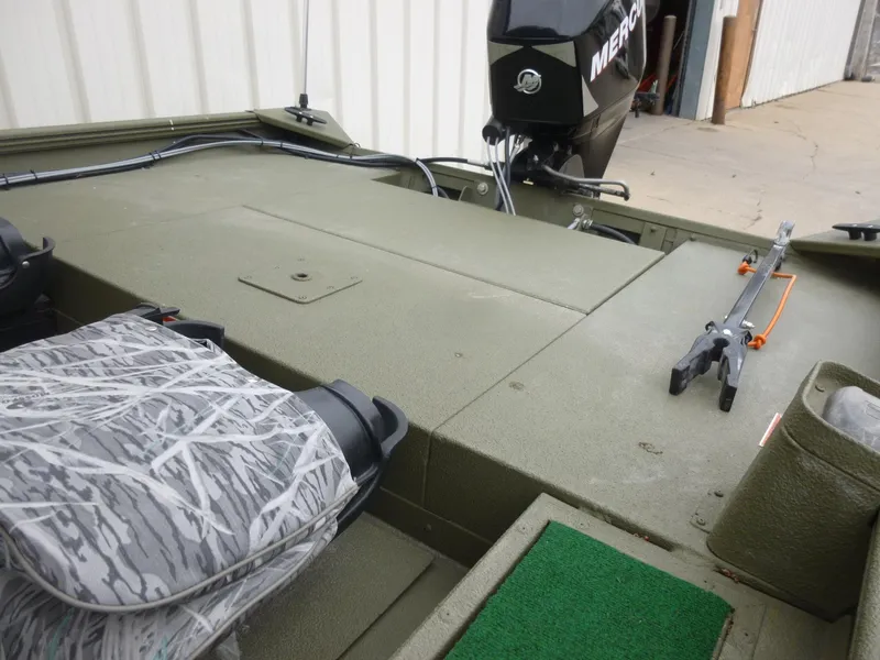 Slide: The Image of 2011 Lowe Roughneck R1760SC boat interior with Mercury outboard motor. - 21