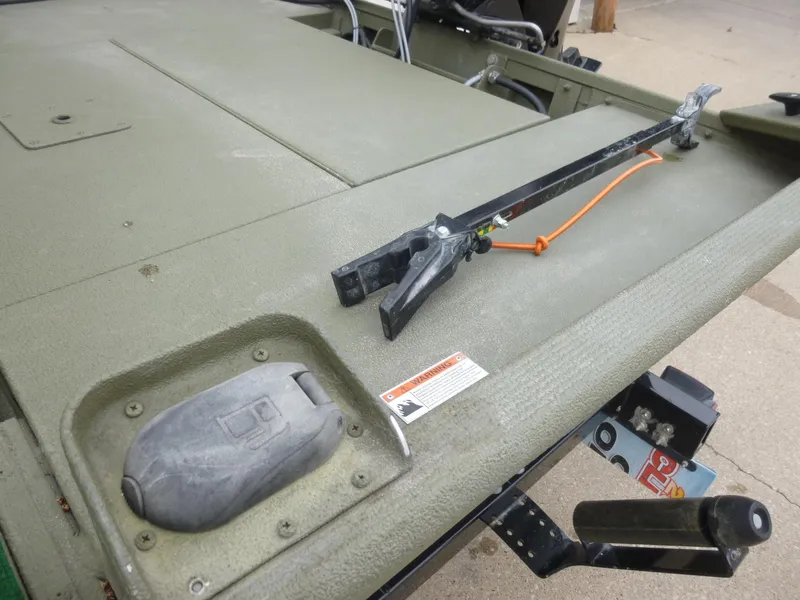 Slide: The Image of 2011 Lowe Roughneck R1760SC boat deck with mounted equipment and trailer hitch. - 22