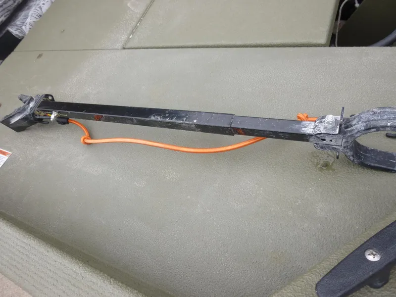 Slide: The Image of Boat accessory on Lowe Roughneck R1760SC, 2011 model, with orange cable and metal bracket. - 24