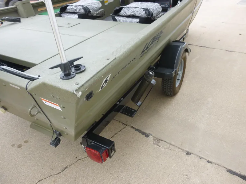 Slide: The Image of 2011 Lowe Roughneck R1760SC boat on trailer, rear view, showing green exterior and trailer light. - 25