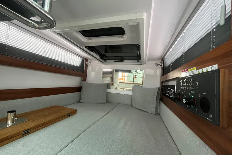 Slide: The Image of 2022 Axopar 28 Cabin interior with Brabus Package, featuring modern design and comfortable seating. - 8
