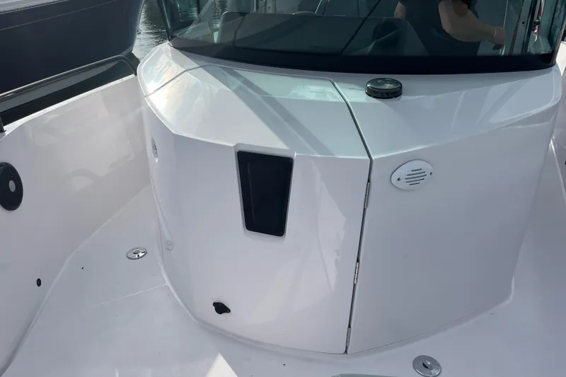 Slide: The Image of 2022 Axopar 28 Cabin with Brabus Package, showcasing sleek white exterior design. - 9