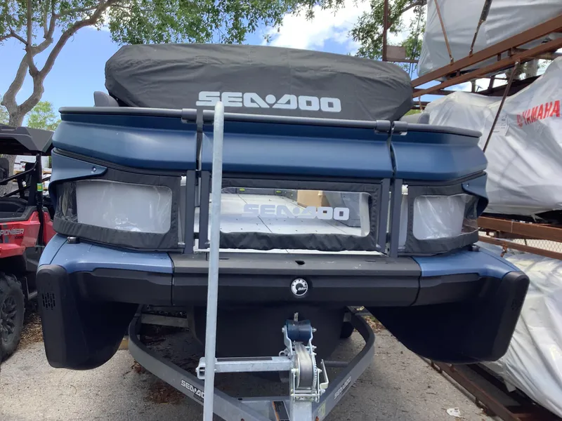 Slide: The Image of 2024 Sea-Doo Switch Cruise 18 on trailer, covered and parked outdoors. - 5
